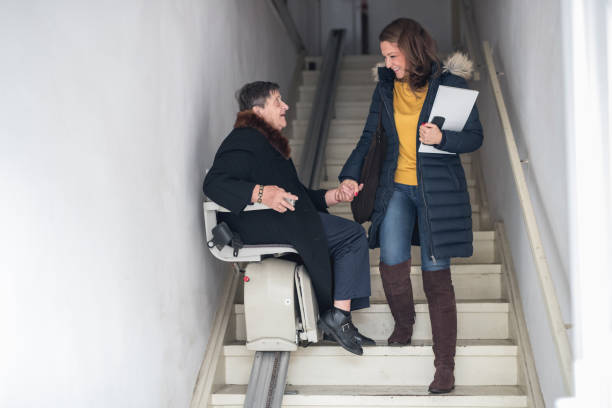 Old woman moving down the stairs