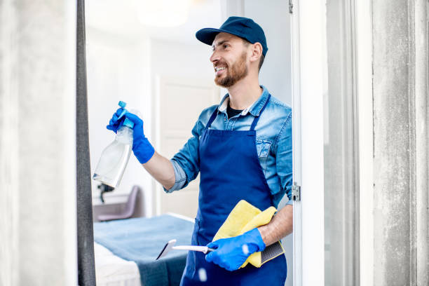 istock Man as a professional cleaner washing window 1080176054