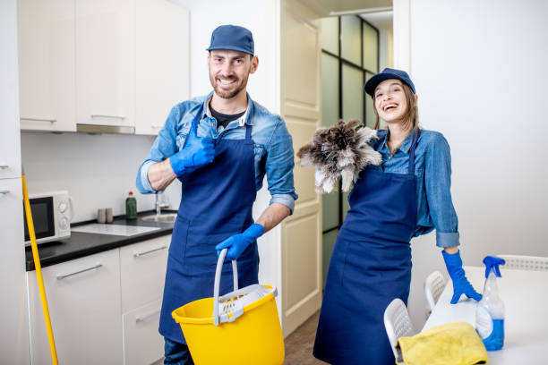 Man and woman as a professional cleaners indoors