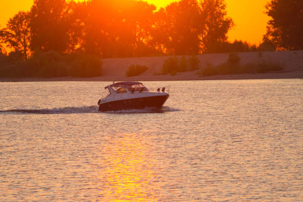 istock luxury motor boat at sunset 1080177354