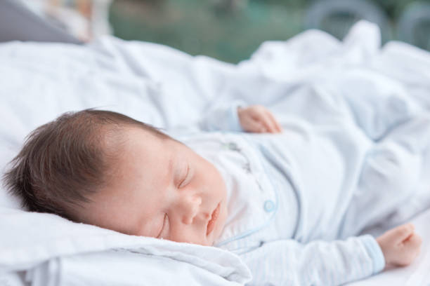 istock baby girl sleeping outdoors 1080184064
