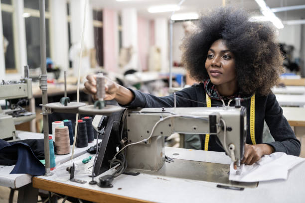istock African worker in fashion factory using sewing machine 1080190752