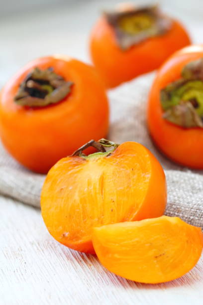 istock Ripe persimmon fruit on wooden table ready for eat 1080195080