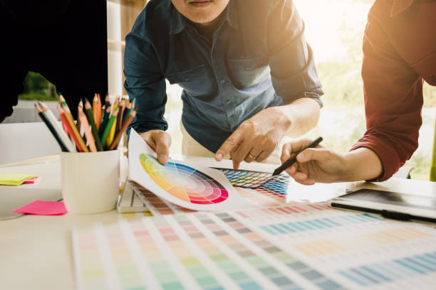 istock Graphic designer working at his desk and is choosing colors together. 1080197974