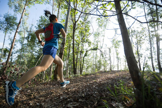 istock Woman trail runner running in forest 1080198876