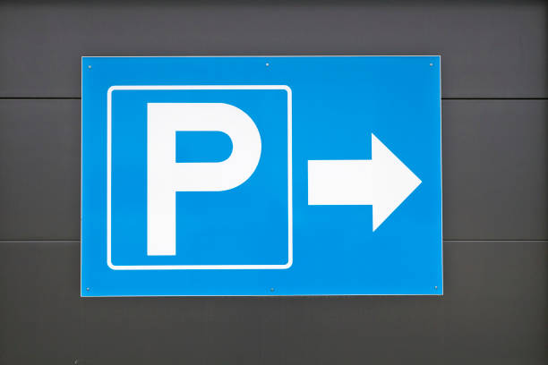 istock parking lot sign with arrow 1080203450