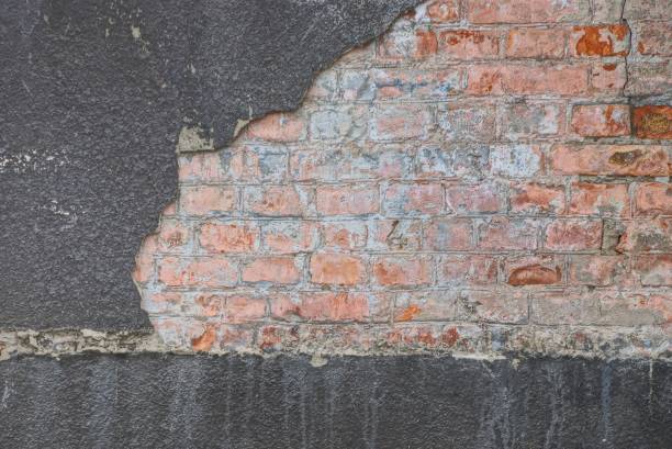 istock brown gray stone background from bricks and plaster on the wall 1080207190