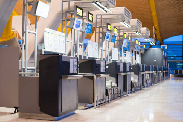 airport inside terminal and check-in counter - airport airport check in counter arrival departure board checkout counter imagens e fotografias de stock