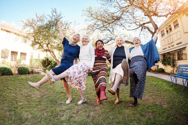 Dance like you've never danced before Full length portrait of a group of happy senior women dancing during a hike in the great outdoors 80 89 years stock pictures, royalty-free photos & images