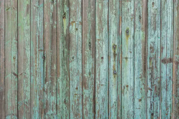 Photo of Beautiful wood texture from old wooden boards and weathered paint