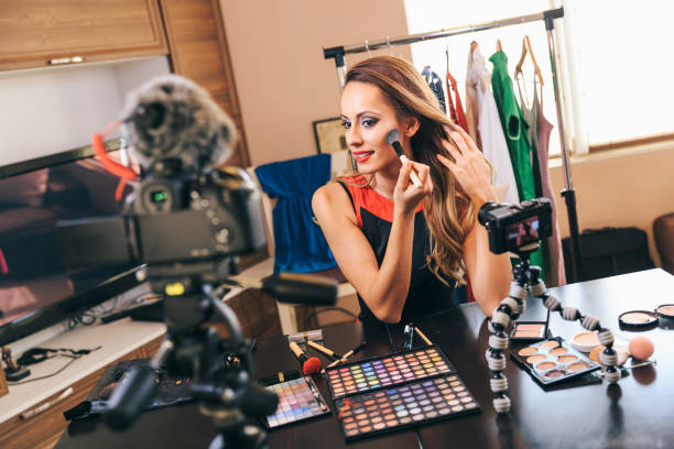 istock Female vlogger making make-up video, applying make-up 1080217822