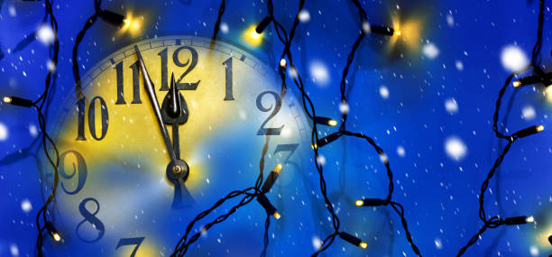 istock Clock face and Christmas electric light before midnight 1080221722