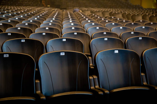istock Empty comfortable chairs seats with numbers in hall 1080221816