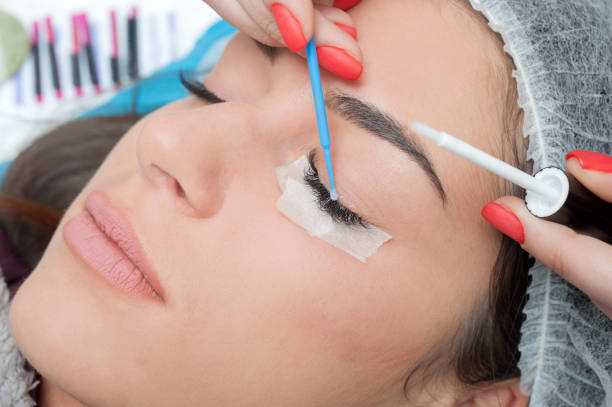 istock Lashmaker make lashes extension. special cosmetic face stickers. 1080222438