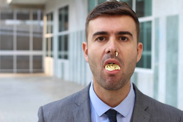 istock Business with worms inside mouth and nose 1080223816