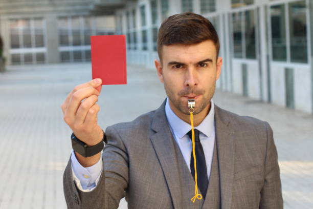 istock Businessman with whistle and red card 1080224214
