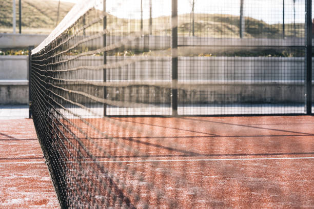 istock net in a padel court with orange grass 1080224392