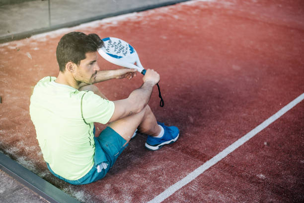 istock Padel player sitting on the floor resting 1080224744