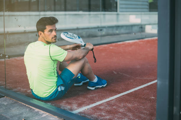 istock Padel player sitting on the floor resting 1080224748