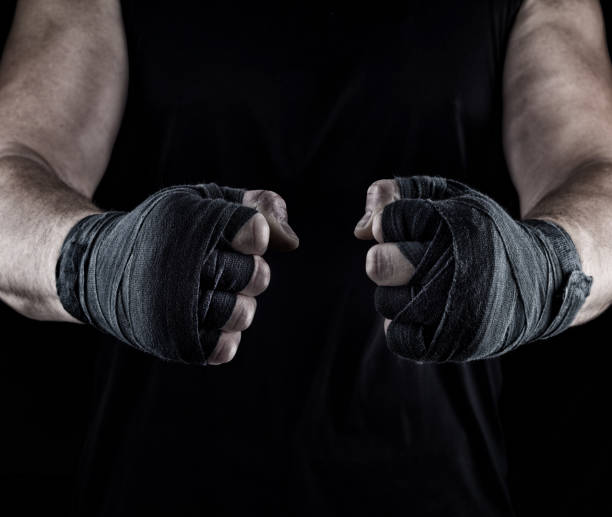 istock men's hands wrapped in a black bandage 1080224850