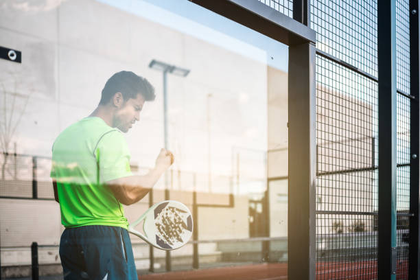Sportsman resting from playing padel