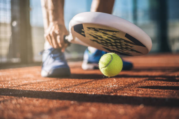 Sportsman playing padel game Sportsman playing padel game table tennis racket stock pictures, royalty-free photos & images