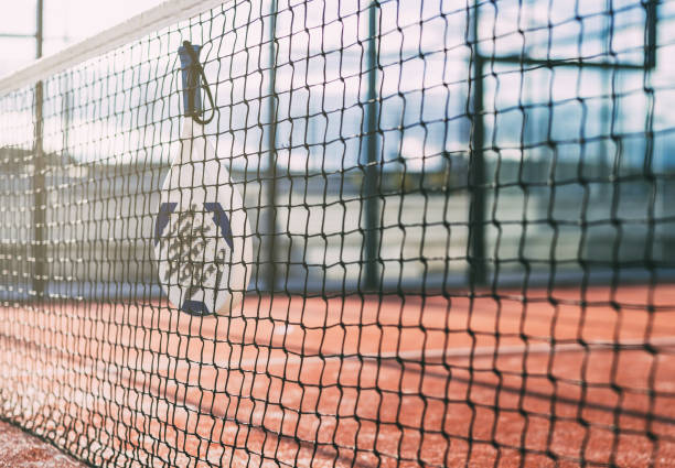 istock Padel blade racket hanging on the net 1080226178