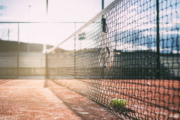 istock Padel blade racket hanging on the net 1080226254