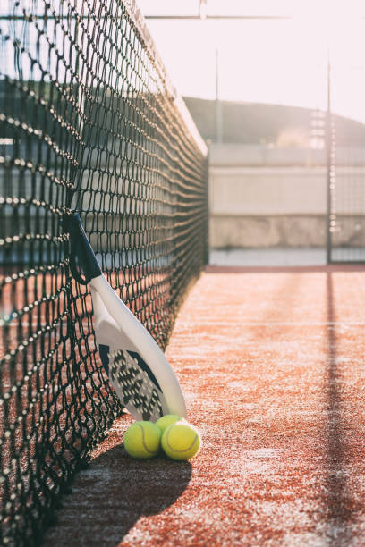 istock Padel blade racket resting on the net 1080226278