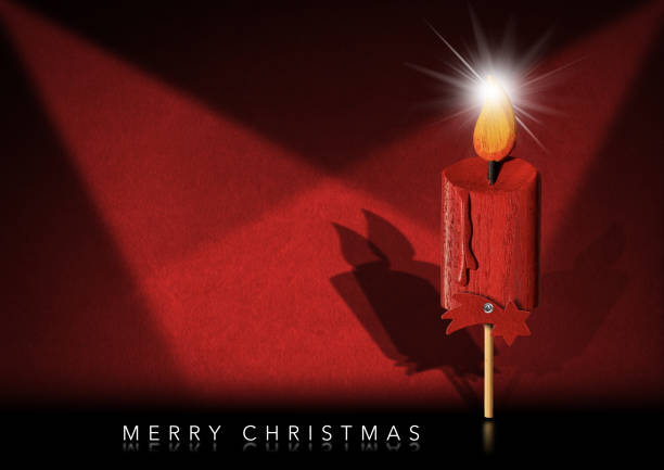 Merry Christmas - Wooden candle with a comet star on a red background with copy space