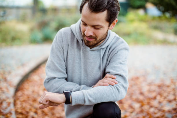 istock Fitness man using smart watch at park 1080233152