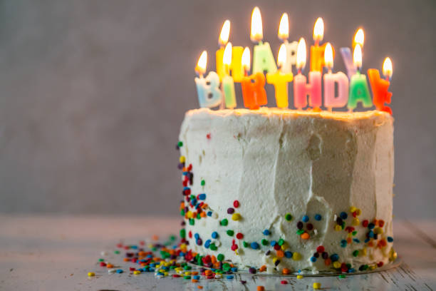 istock Colorful birthday concept - cake, candles, presents, decorations 1080234568