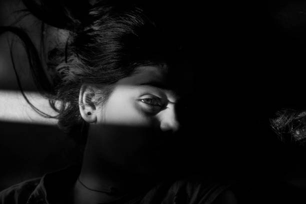istock Sunlight shadow on girl face 1080236072