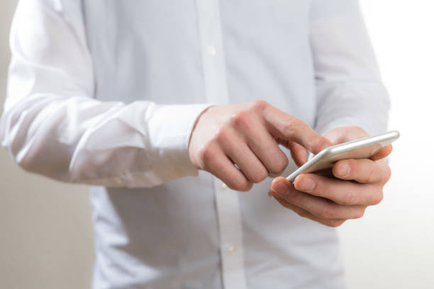 istock man with a mobile phone in his hands 1080236942