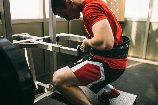 istock Man exercising in gym 1080237648