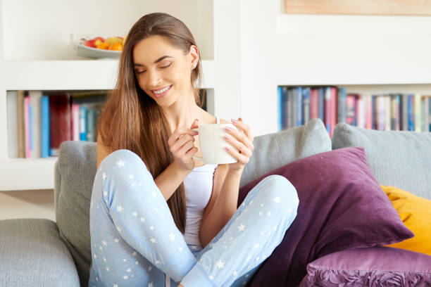 istock Young woman relaxing on sofa early morning 1080240906