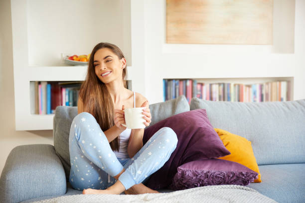 istock Young woman relaxing on sofa early morning 1080240940