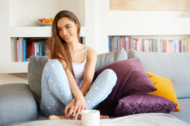istock Young woman relaxing on sofa morning 1080241980
