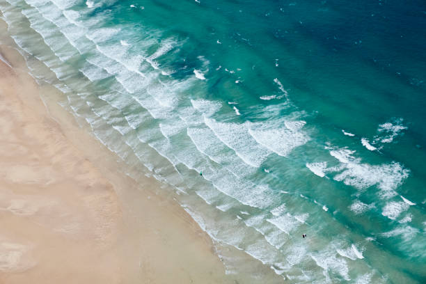 Aerial Views over Porthkidney Beach, Hayle, Cornwall on a sunny June day. Aerial Views over Porthkidney Beach, Hayle, Cornwall on a sunny June day. st ives cornwall stock pictures, royalty-free photos & images