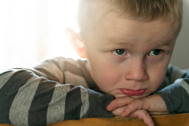 istock Upset problem child sit on chair concept for bullying, depression stress 1080247394