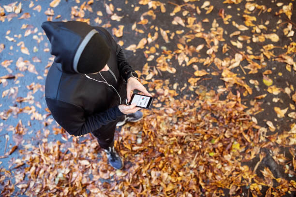 istock Man checking his fitness performance on smart phone 1080247570