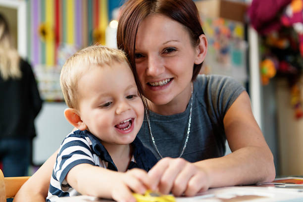 istock Cute little boy drawing at kindergarten. Creative kid at playschool 1080247716