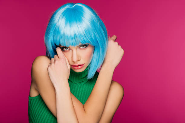 istock beautiful model with blue hair, isolated on pink 1080248932