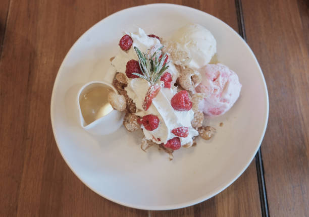 istock Sweet dessert, vanilla ice cream and bread on top with raspberry 1080251494