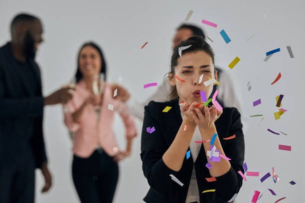 istock The beautiful woman blowing confetti 1080254318