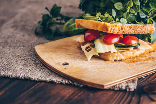 istock Toast with maasdam cheese, tomato, cucumber and basil. 1080254394