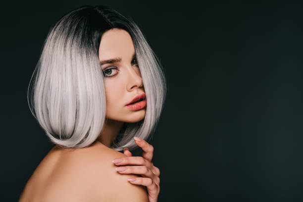 istock sensual naked model posing in grey wig, isolated on black 1080256206