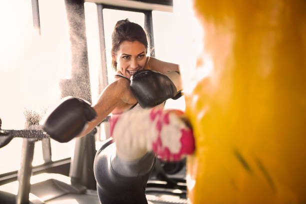 istock Young woman training with punching bag 1080265500