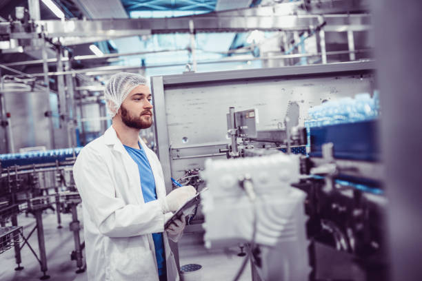 istock Line Technician Writing Down a Results From Production Line 1080265686