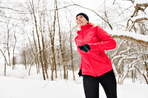 istock Blond woman running outdoors on a cold winter day 1080269068
